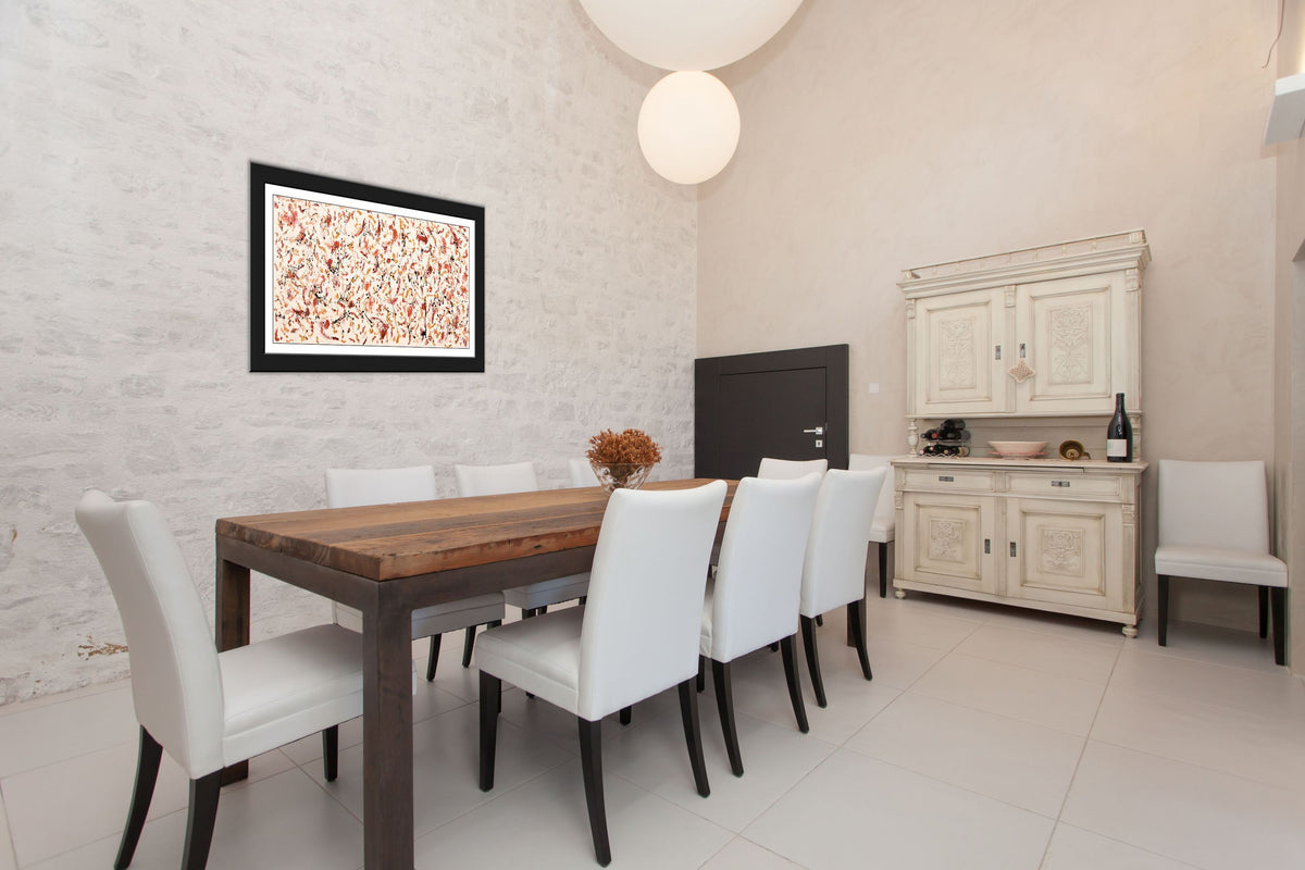 Scattered Mind — original abstract painting by Gallery 68 displayed in a contemporary dining room, framed in black, showing warm cream, orange and earthy tones with dark flecks